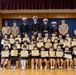 Graduation: Volunteers from Marine Corps Air Station Iwakuni hand out graduation certificates