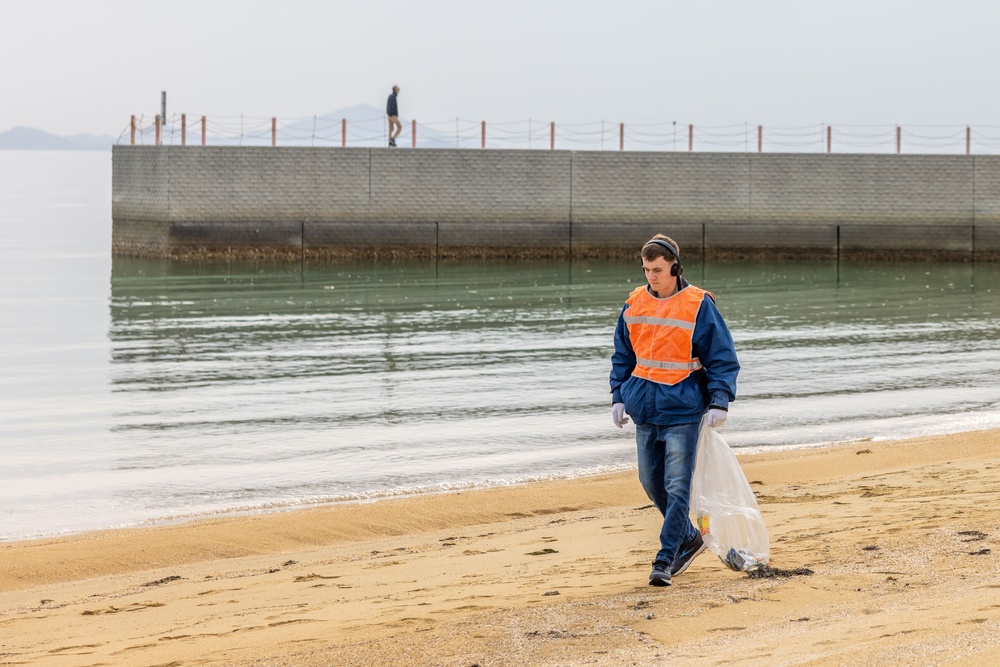 Marines and Sailors from MCAS Iwakuni participate in a beach cleanup