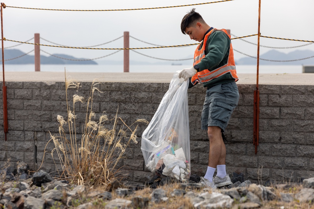 Marines and Sailors from MCAS Iwakuni participate in a beach cleanup