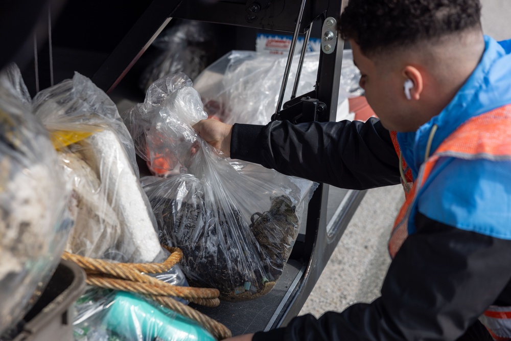 Marines and Sailors from MCAS Iwakuni participate in a beach cleanup