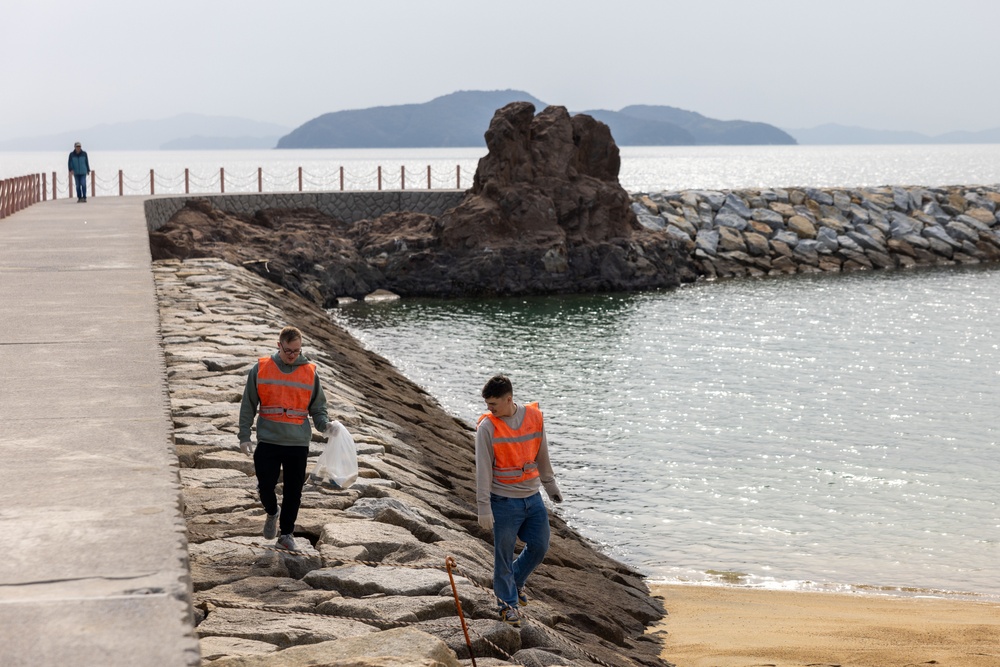 Marines and Sailors from MCAS Iwakuni participate in a beach cleanup