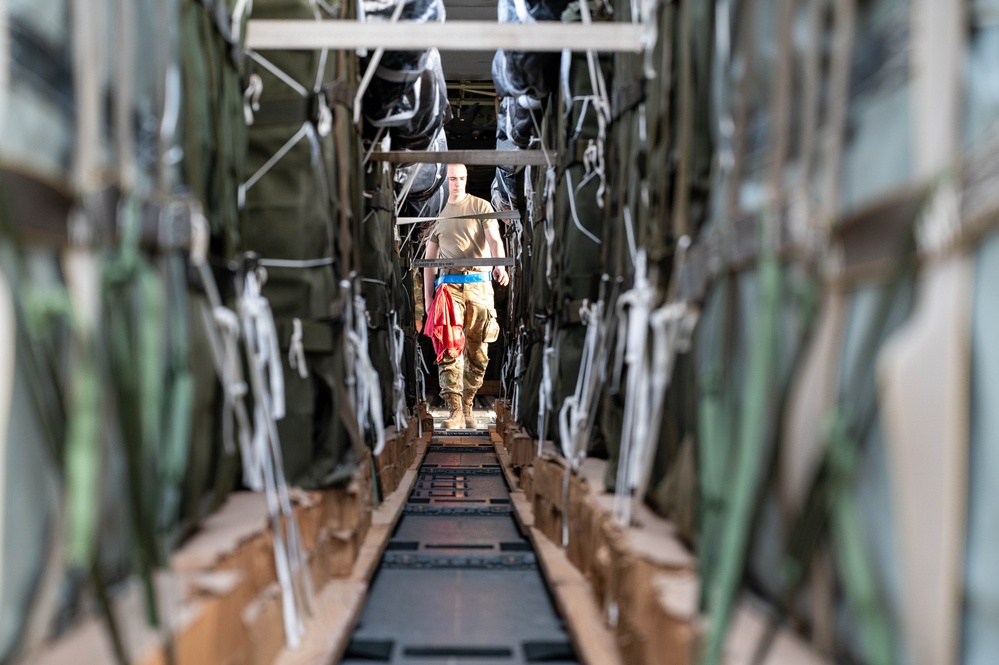Airmen load AFCENT C-130s with humanitarian aid bound for Gaza