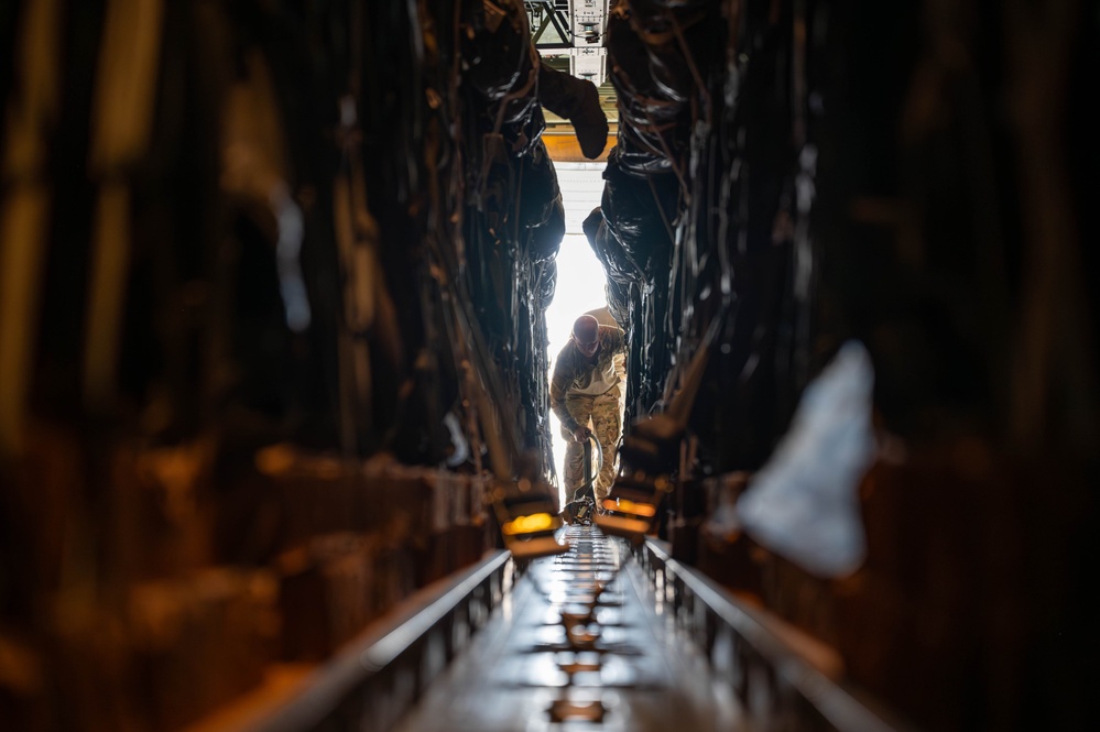 Airmen load AFCENT C-130s with humanitarian aid bound for Gaza