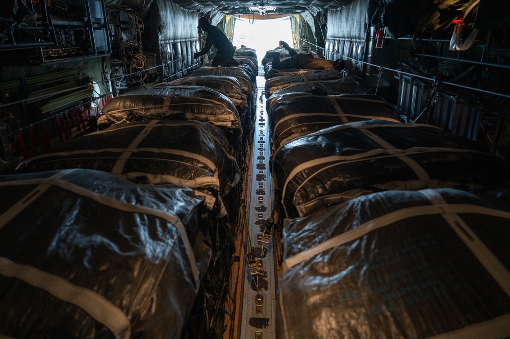 Airmen load AFCENT C-130s with humanitarian aid bound for Gaza