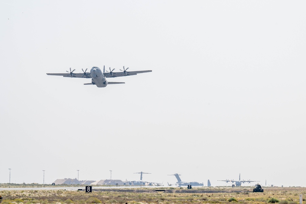 Airmen load AFCENT C-130s with humanitarian aid bound for Gaza