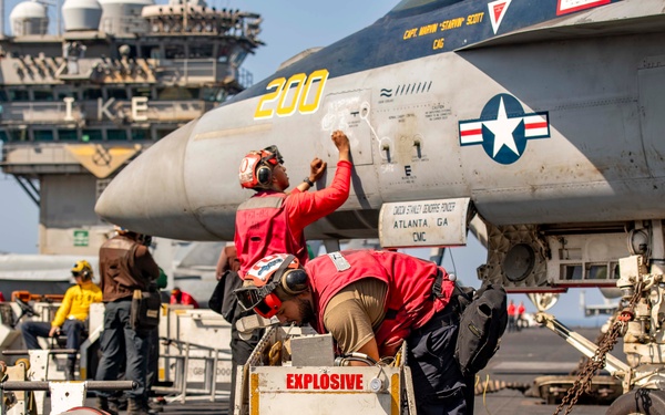 Ordnancemen Aboard the USS Dwight D. Eisenhower Prepare for Flight Operations in the Red Sea