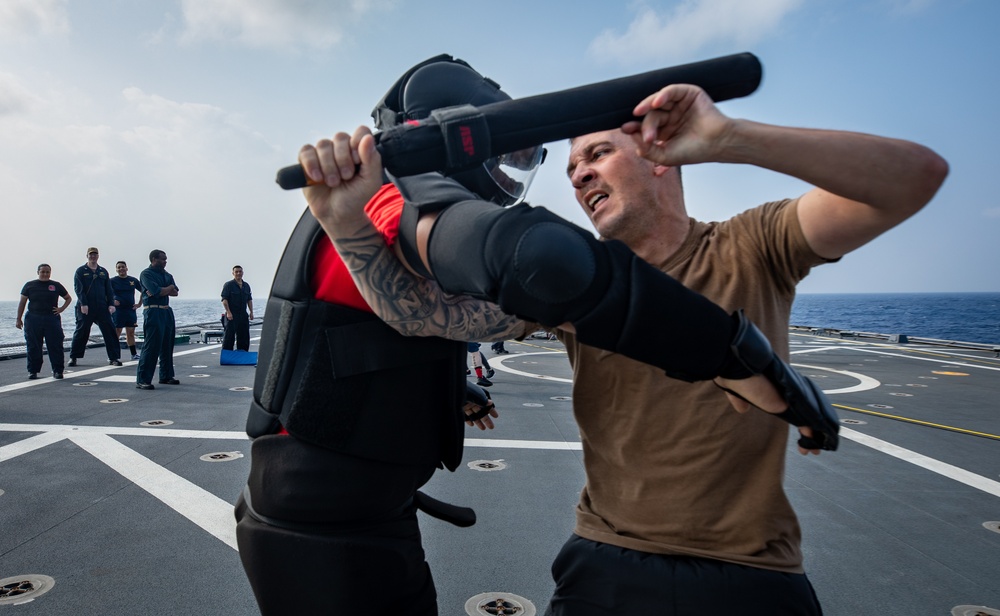 USS Mobile (LCS 26) Gold Crew sailors receive OC spray, demonstrate security force skills