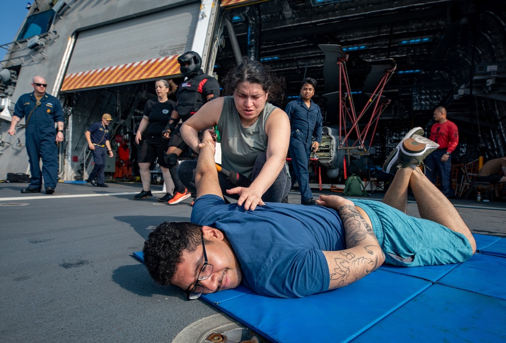 USS Mobile (LCS 26) Gold Crew sailors receive OC spray, demonstrate security force skills