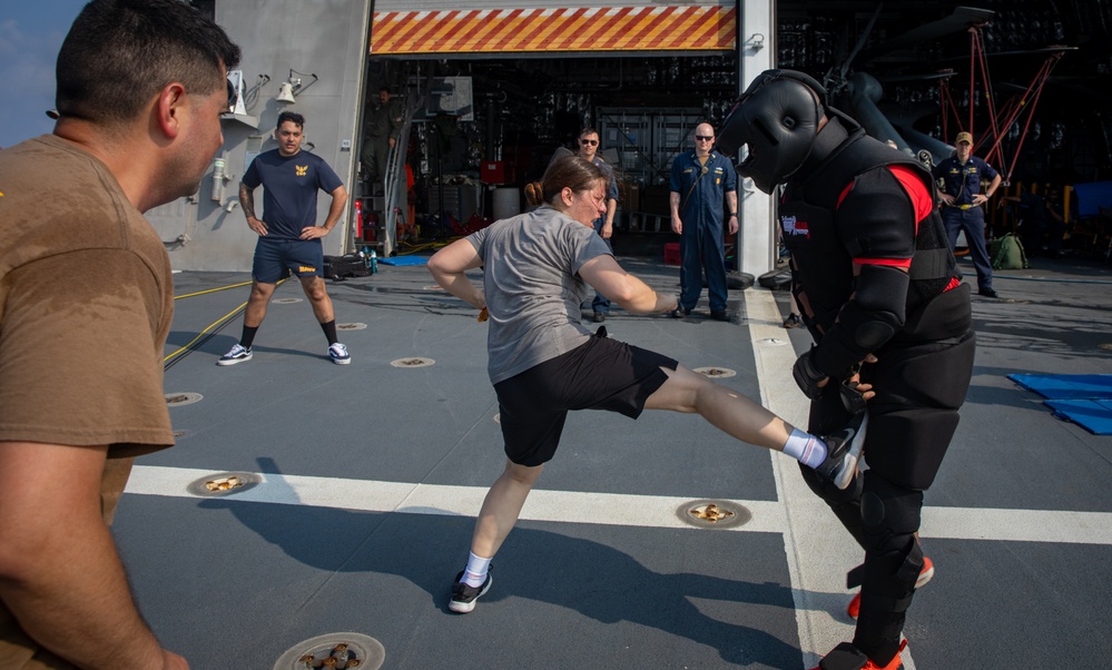 USS Mobile (LCS 26) Gold Crew sailors receive OC spray, demonstrate security force skills