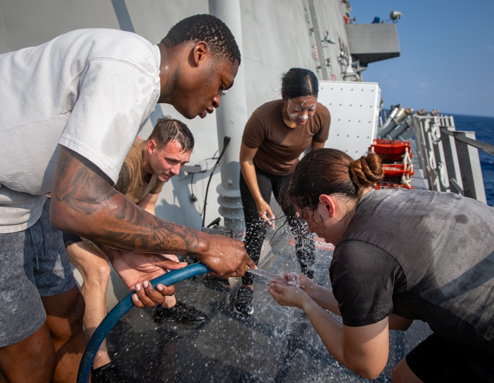 USS Mobile (LCS 26) Gold Crew sailors receive OC spray, demonstrate security force skills
