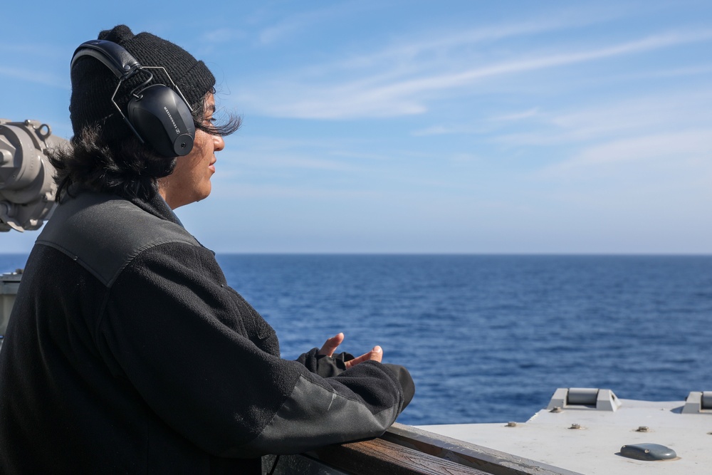 Sailors aboard the USS Howard conduct a surface warfare exercise in the Philippine Sea