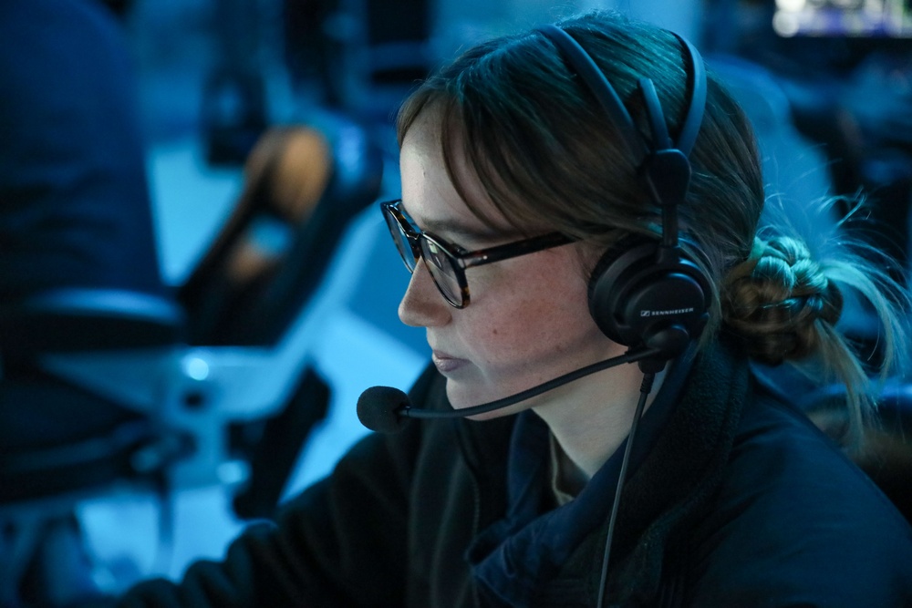 Sailors aboard the USS Howard conduct a surface warfare exercise in the Philippine Sea