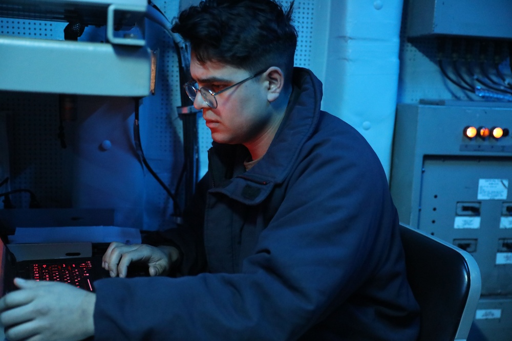 Sailors aboard the USS Howard conduct a surface warfare exercise in the Philippine Sea