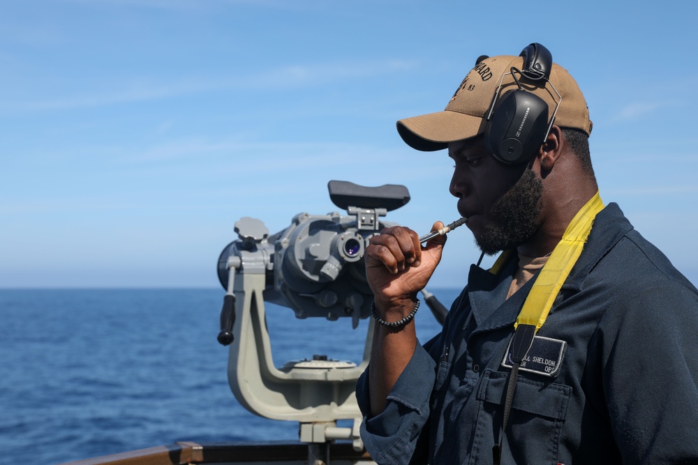 Sailors aboard the USS Howard conduct a surface warfare exercise in the Philippine Sea