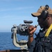 Sailors aboard the USS Howard conduct a surface warfare exercise in the Philippine Sea