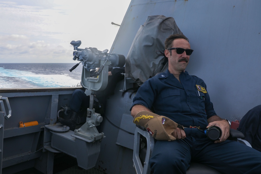 Sailors aboard the USS Howard conduct an evasive maneuver exercise in the Philippine Sea