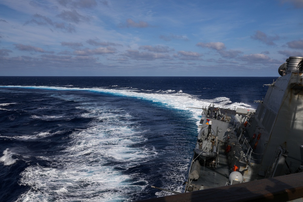 Sailors aboard the USS Howard conduct an evasive maneuver exercise in the Philippine Sea