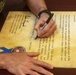 MajGen Liszewski signs the Child Abuse Prevention Month proclamation on Camp Foster