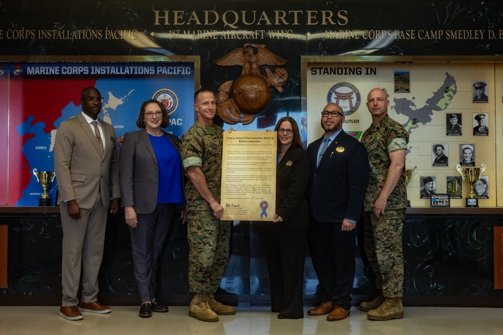 MajGen Liszewski signs the Child Abuse Prevention Month proclamation on Camp Foster