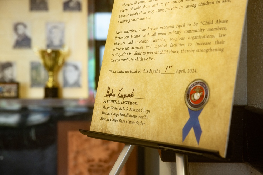 MajGen Liszewski signs the Child Abuse Prevention Month proclamation on Camp Foster