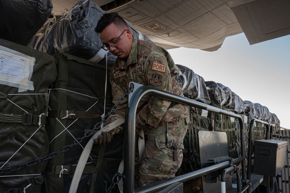 Airmen load AFCENT C-130s with humanitarian aid bound for Gaza