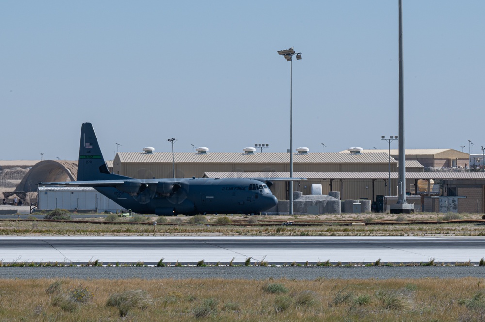 Airmen load AFCENT C-130s with humanitarian aid bound for Gaza