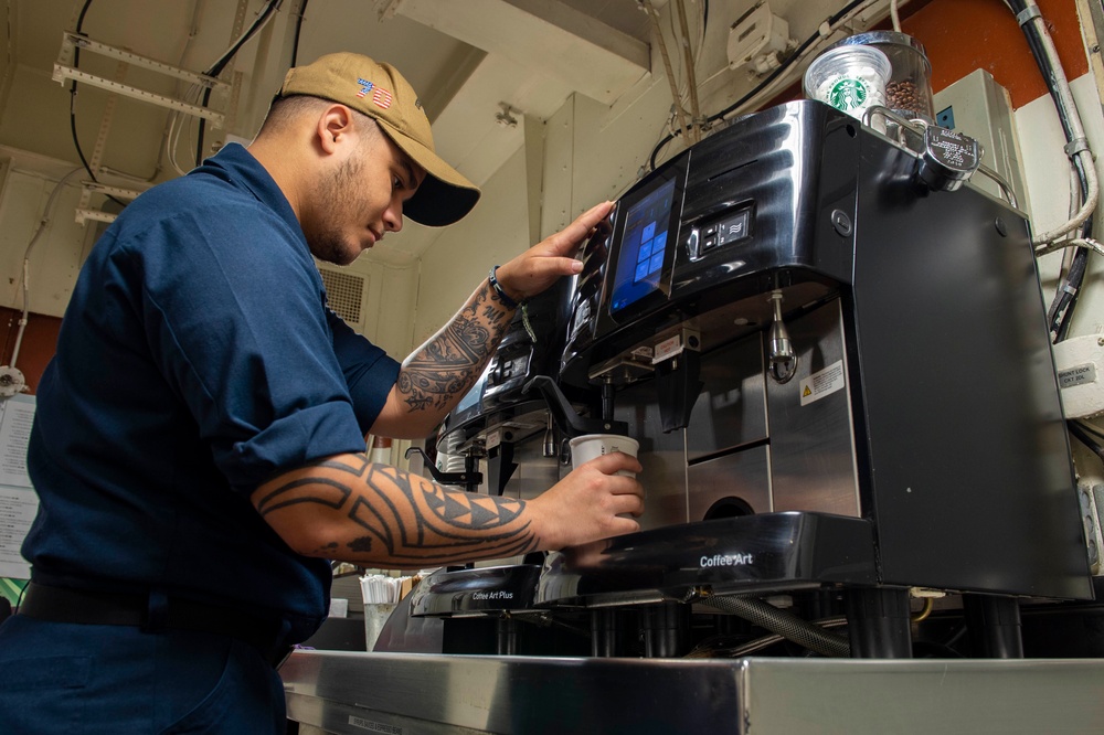 USS Carl Vinson (CVN 70) Sailor Prepares Coffee
