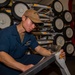 USS Carl Vinson (CVN 70) Sailor Cleans Drawbars