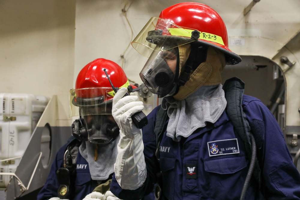Sailors aboard the USS Howard conduct damage control training team drills in the Philippine Sea