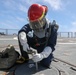 Sailors aboard the USS Howard conduct a damage control training team drill in the Philippine Sea