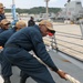 Sailors aboard the USS Howard conduct a sea and anchor detail in Okinawa, Japan