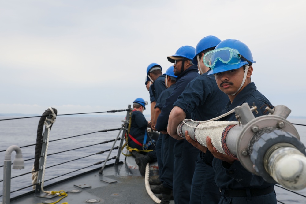 Sailors aboard the USS Howard conduct a sea and anchor detail in Okinawa, Japan