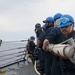 Sailors aboard the USS Howard conduct a sea and anchor detail in Okinawa, Japan