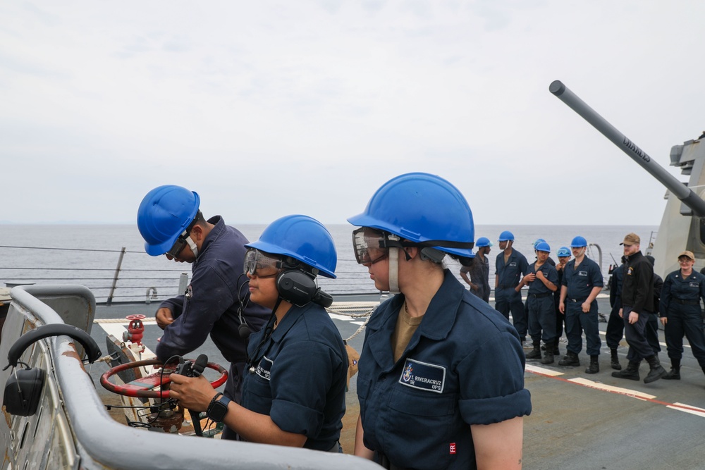 Sailors aboard the USS Howard conduct a sea and anchor detail in Okinawa, Japan