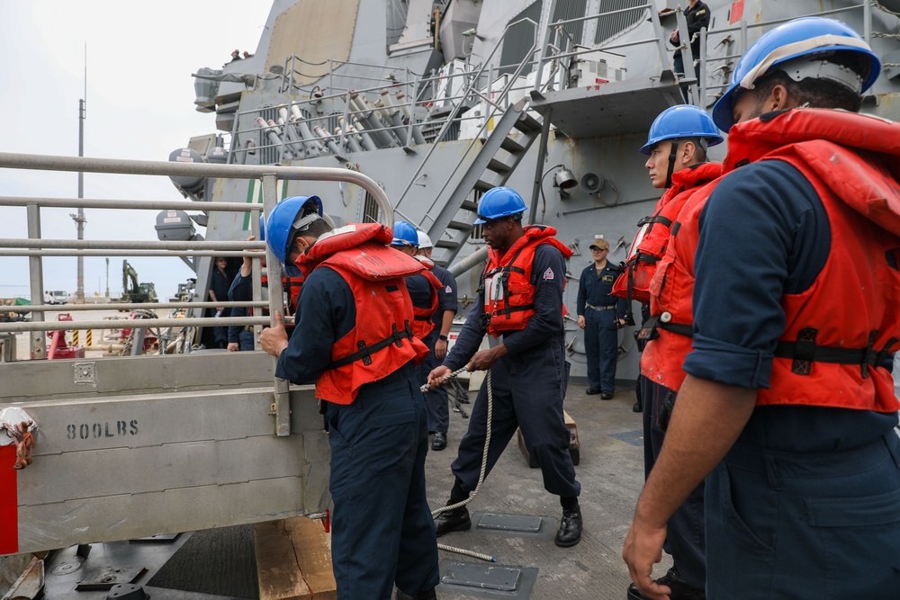 Sailors aboard the USS Howard conduct a sea and anchor detail in Okinawa, Japan