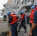 Sailors aboard the USS Howard conduct a sea and anchor detail in Okinawa, Japan