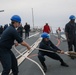 Sailors aboard the USS Howard conduct a sea and anchor detail in Okinawa, Japan