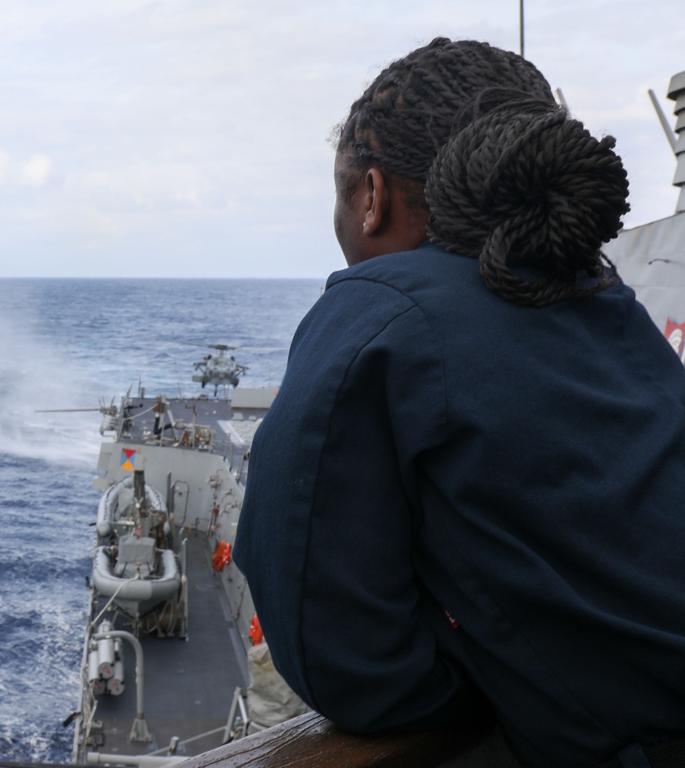 Sailors aboard the USS Howard stand watch during a flight quarters in the Philippine Sea