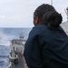 Sailors aboard the USS Howard stand watch during a flight quarters in the Philippine Sea