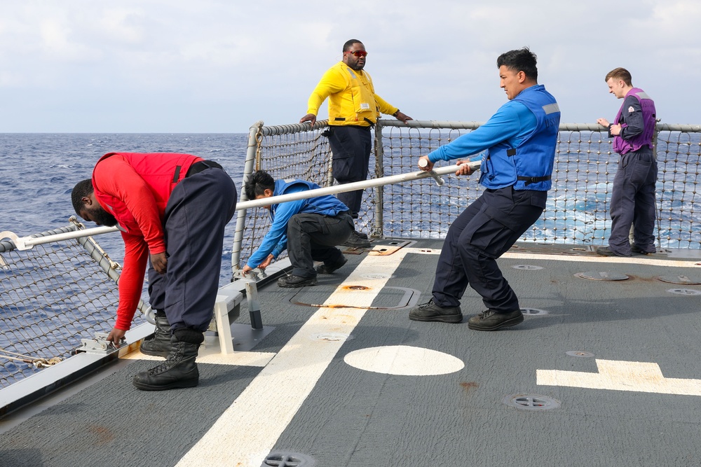 Sailors aboard the USS Howard conduct flight quarters in the Philippine Sea