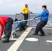 Sailors aboard the USS Howard conduct flight quarters in the Philippine Sea