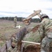 Engineers build and maintain trenches in training area