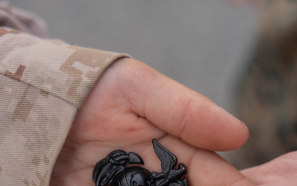 Pvt Analise Yacone receives eagle, globe and anchor