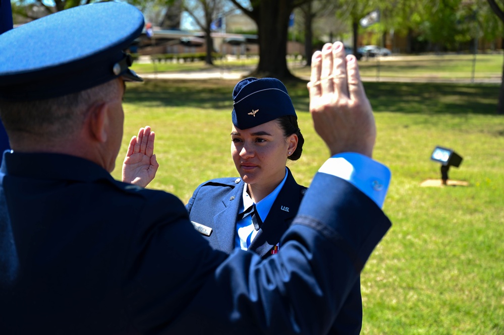 Crow 01 presides over OTS graduation, commissions first wing graduate