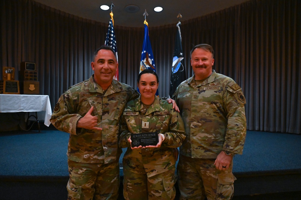 Crow 01 presides over OTS graduation, commissions first wing graduate