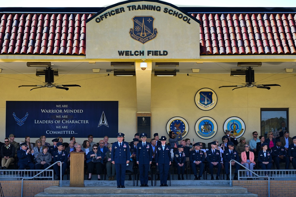 Crow 01 presides over OTS graduation, commissions first wing graduate