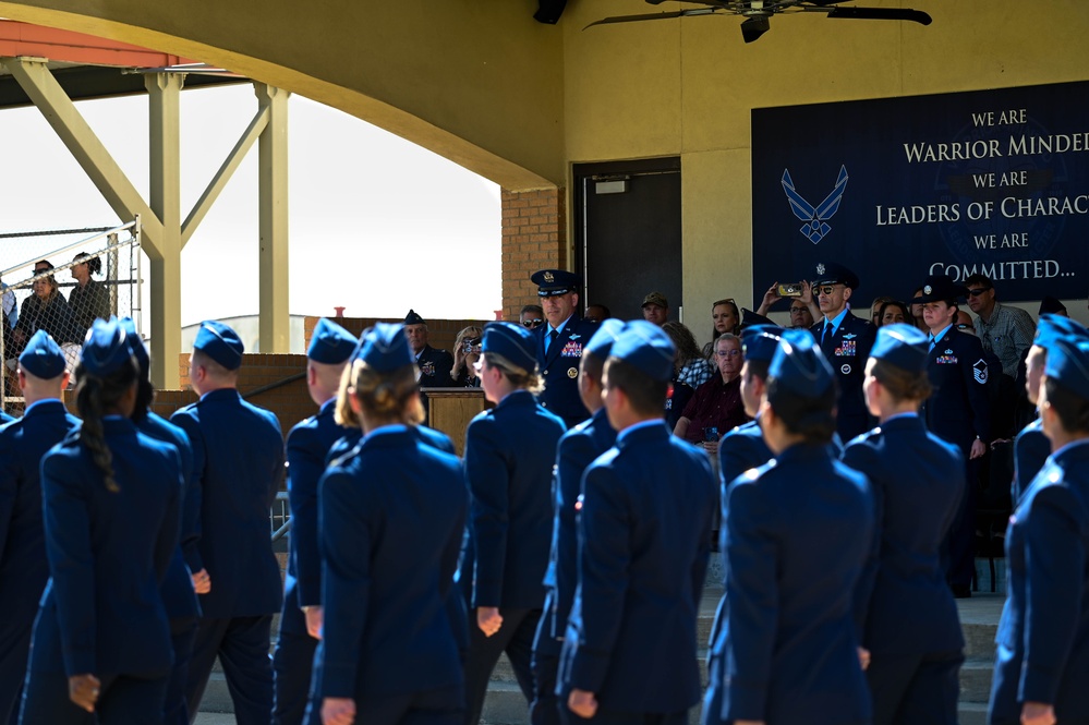 Crow 01 presides over OTS graduation, commissions first wing graduate