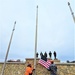 Raising flag at Fort McCoy's Veterans Memorial Plaza