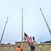 Raising flag at Fort McCoy's Veterans Memorial Plaza