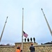 Raising flag at Fort McCoy's Veterans Memorial Plaza